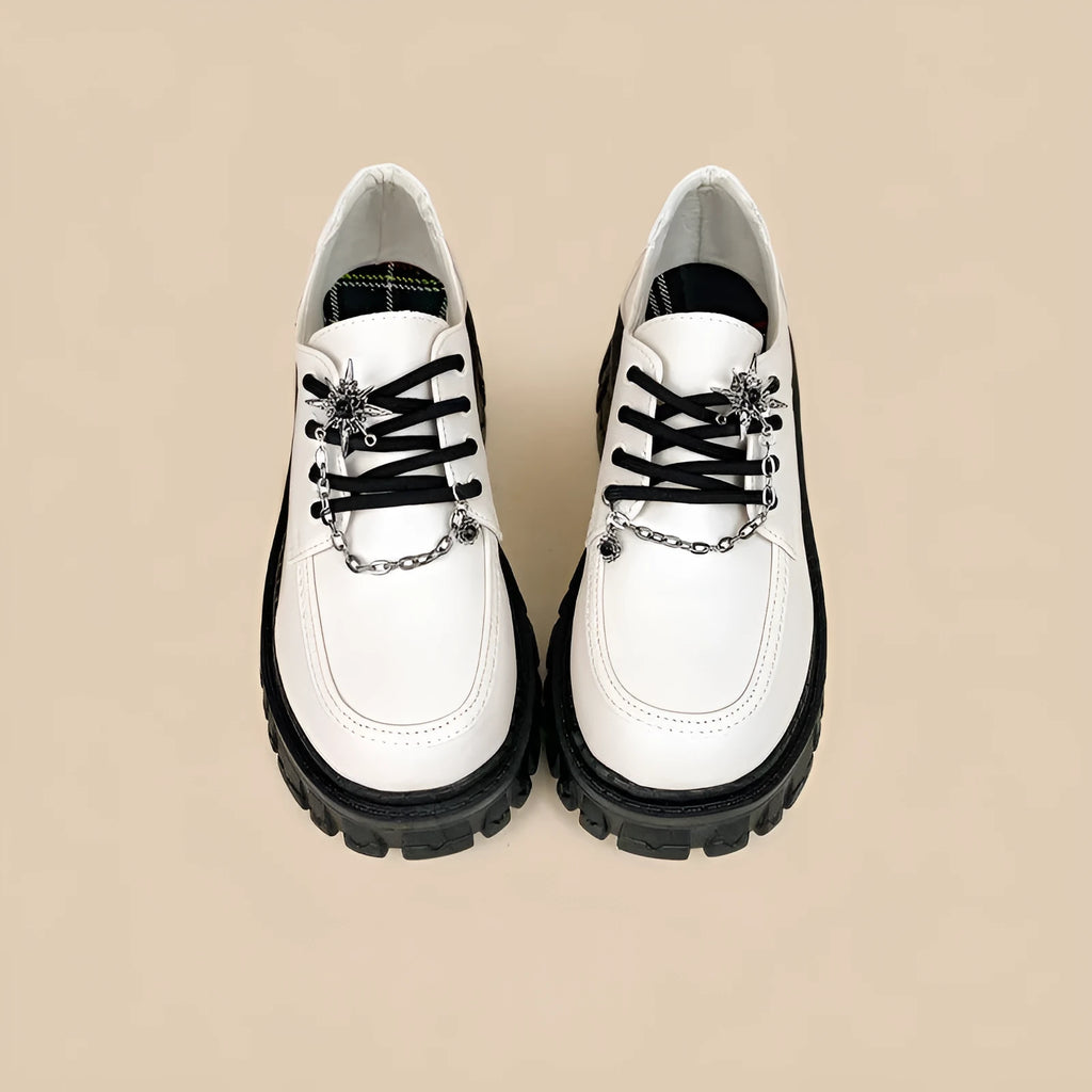 Women's Duke Asterism loafers with a metal cross strap and round toe in preppy college style.