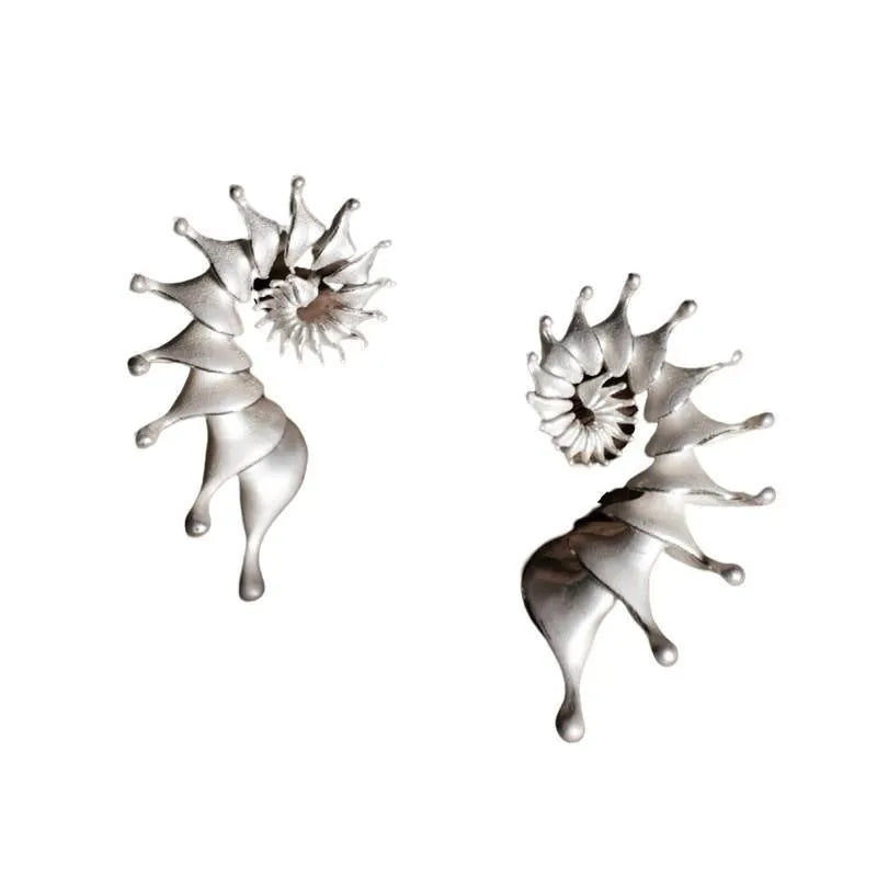 A pair of matte finish alloy conch stud earrings with a three-dimensional, irregular shape.