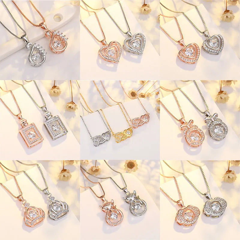 Silver love heart necklace with crown and bow details on clavicle-length chain