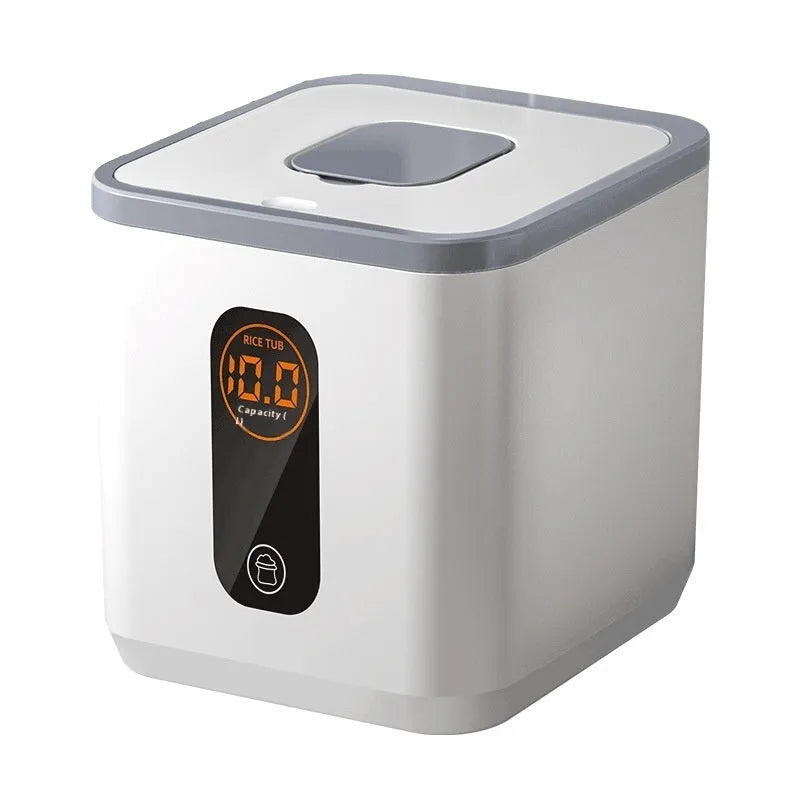 Simple grey plastic rice storage jar with sealed lid and a measuring cup on a kitchen counter.