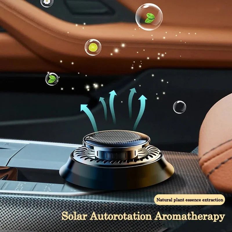 Solar powered kinetic double ring rotating car air freshener diffuser in black plastic.