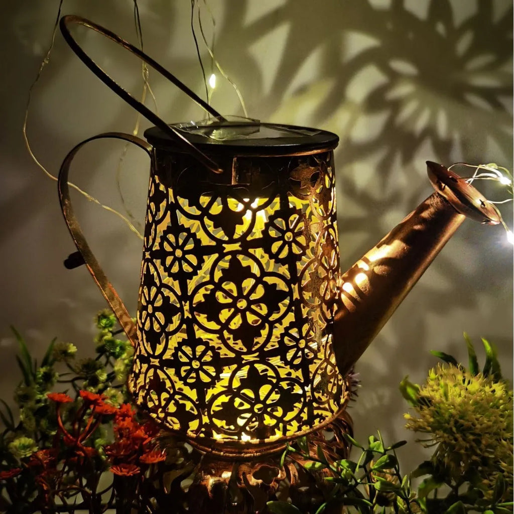 Solar butterfly kettle garden light with wrought iron construction and decorative design