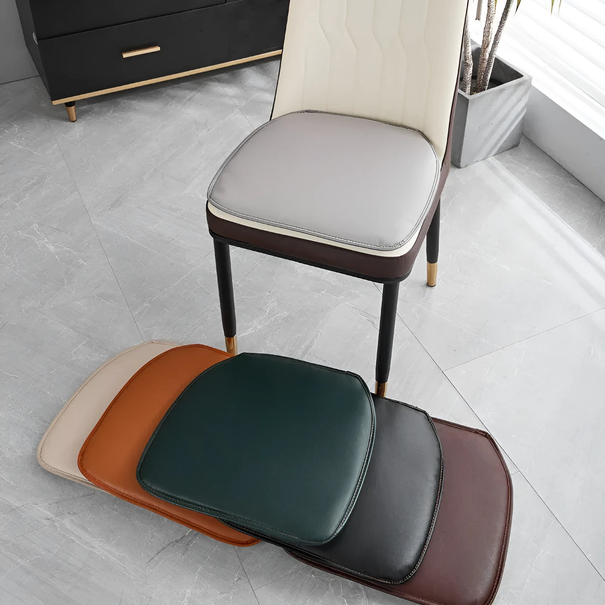 Horseshoe-shaped leather seat cushion in a solid colour with a non-slip base.