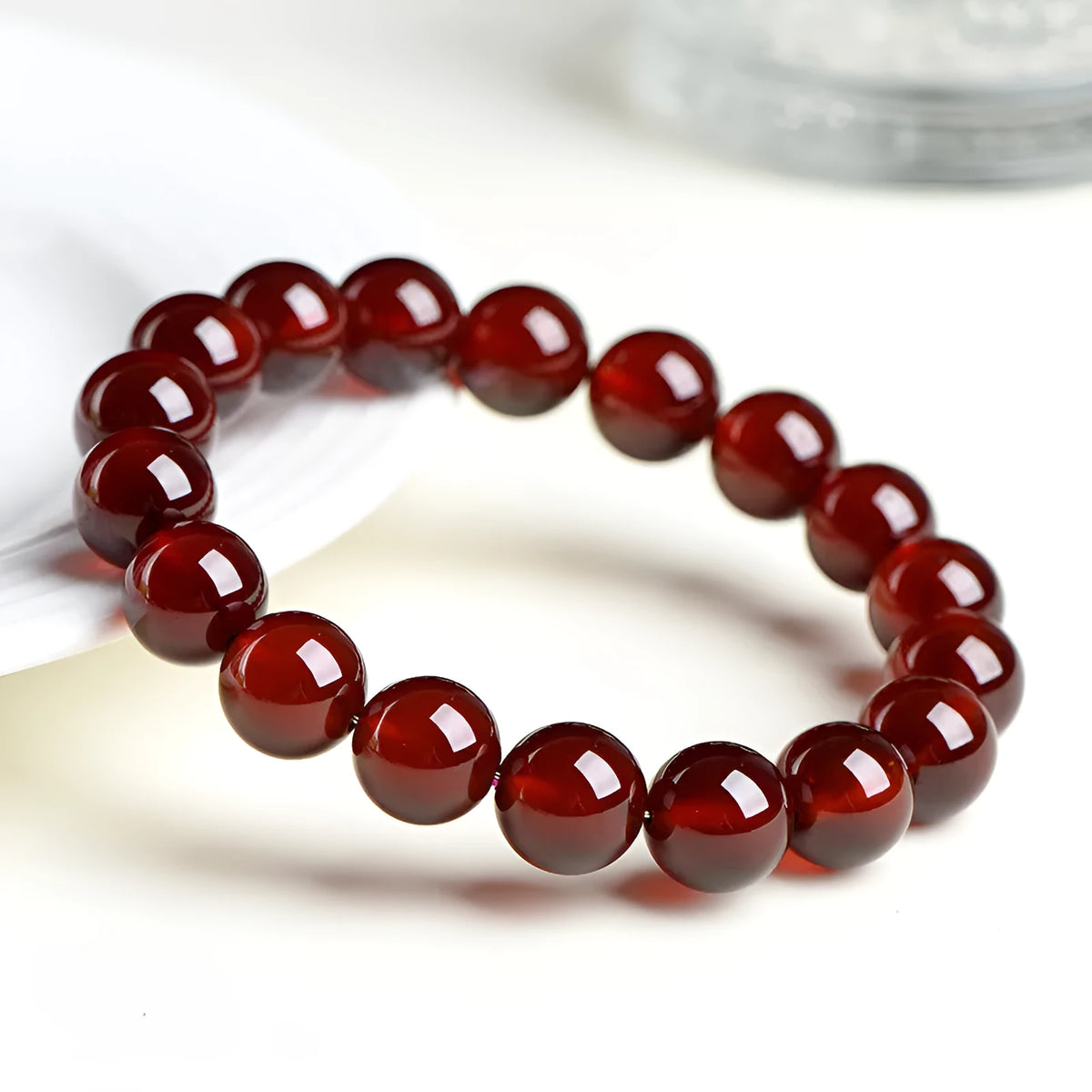 Natural orange red garnet crystal bead bracelet with retro design on wrist
