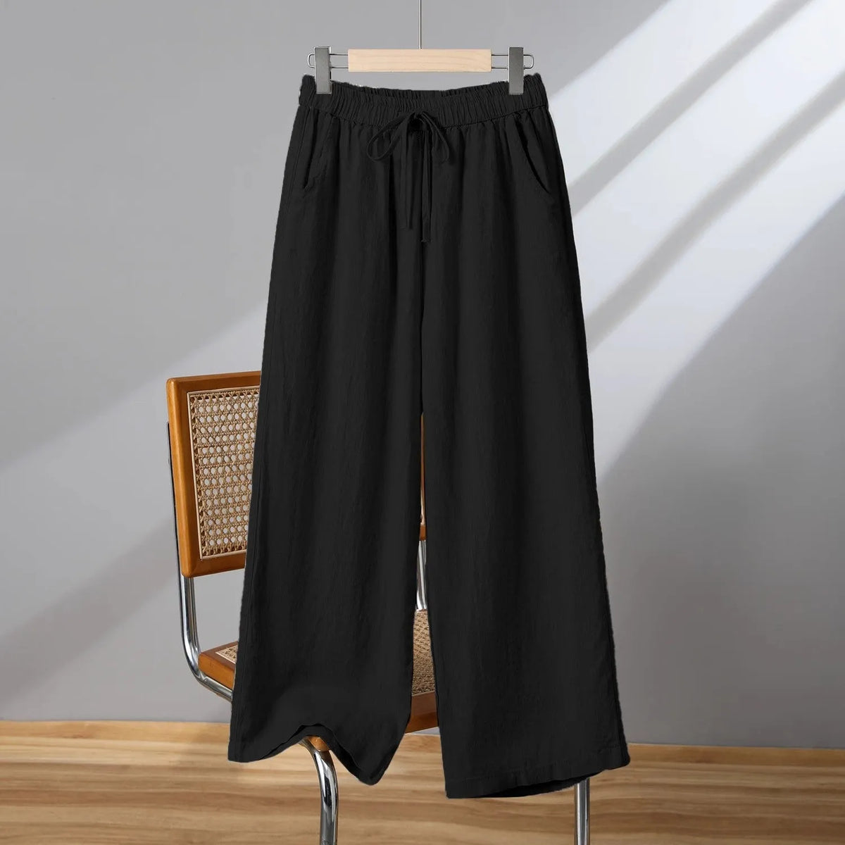 Women's straight-leg casual trousers with elastic waistband and lace-up drawstring detail in four colour options