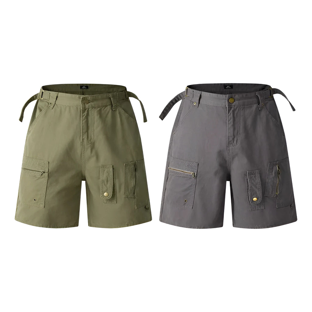 Men's and women's grey washed cotton retro workwear shorts with a loose fit and half elastic waistband on a hanger.