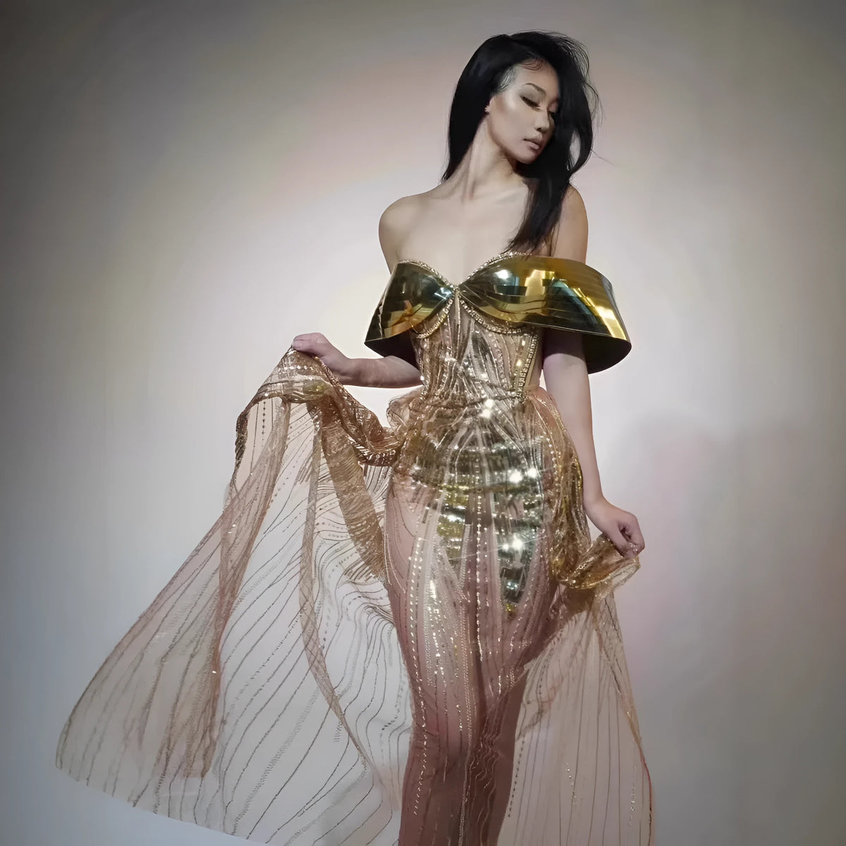 Gold strapless sequined evening dress with tulle skirt and high split detail