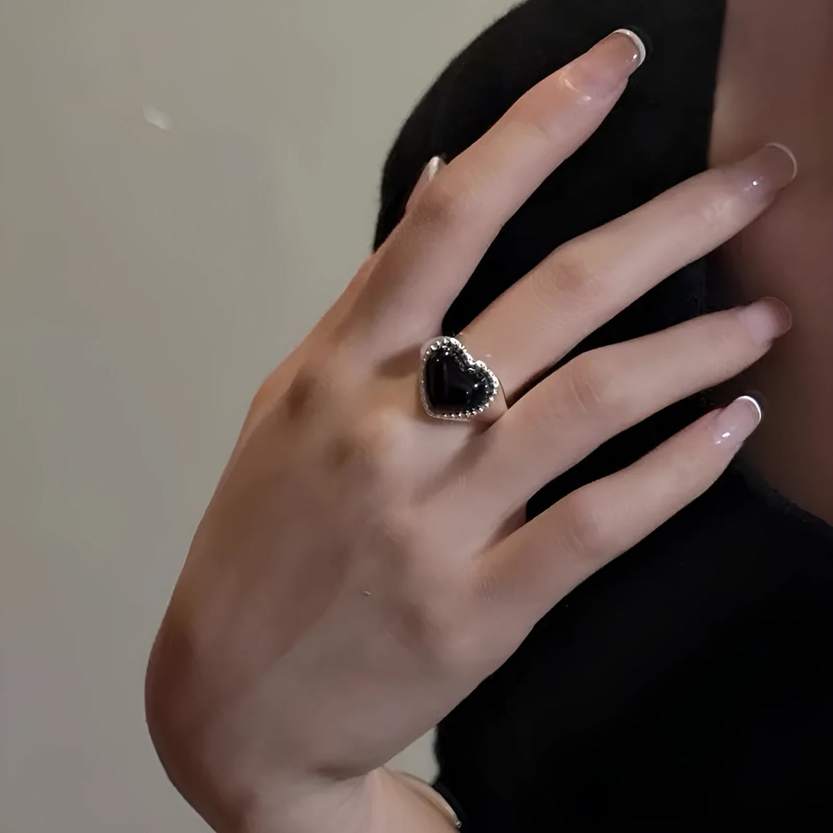S925 sterling silver adjustable ring with black agate heart in open mouth design.