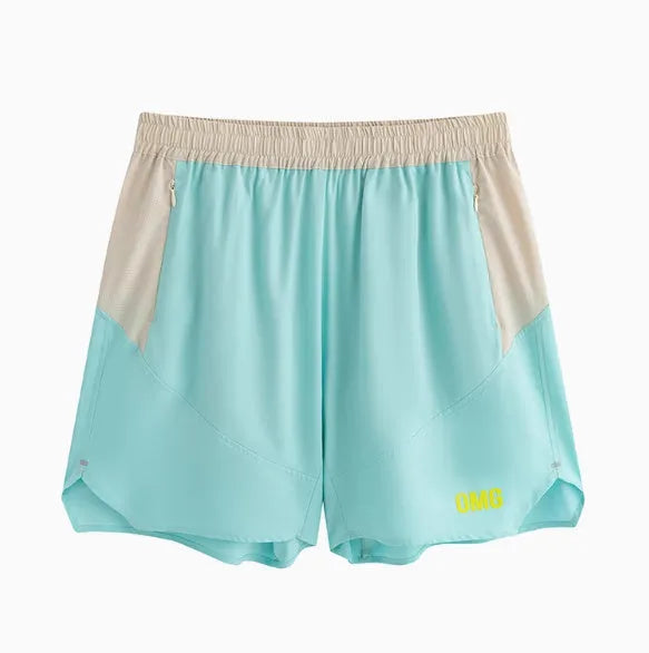 Men's loose grey workout shorts with elastic lace-up waistband on a hanger.