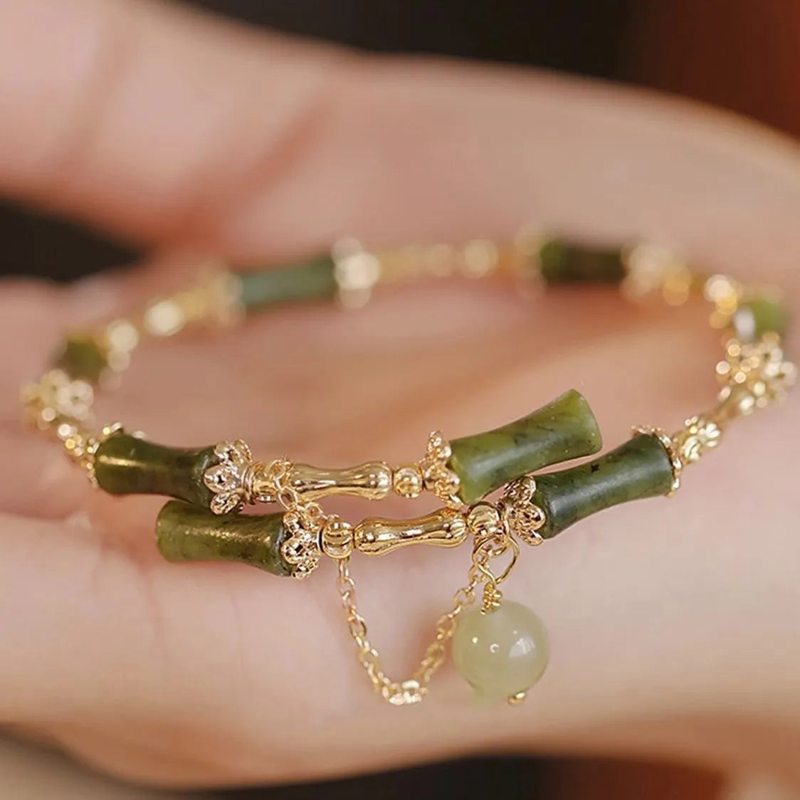 Women's bamboo bead bracelet with coloured glaze beads in plum wine colour showing bamboo joint design
