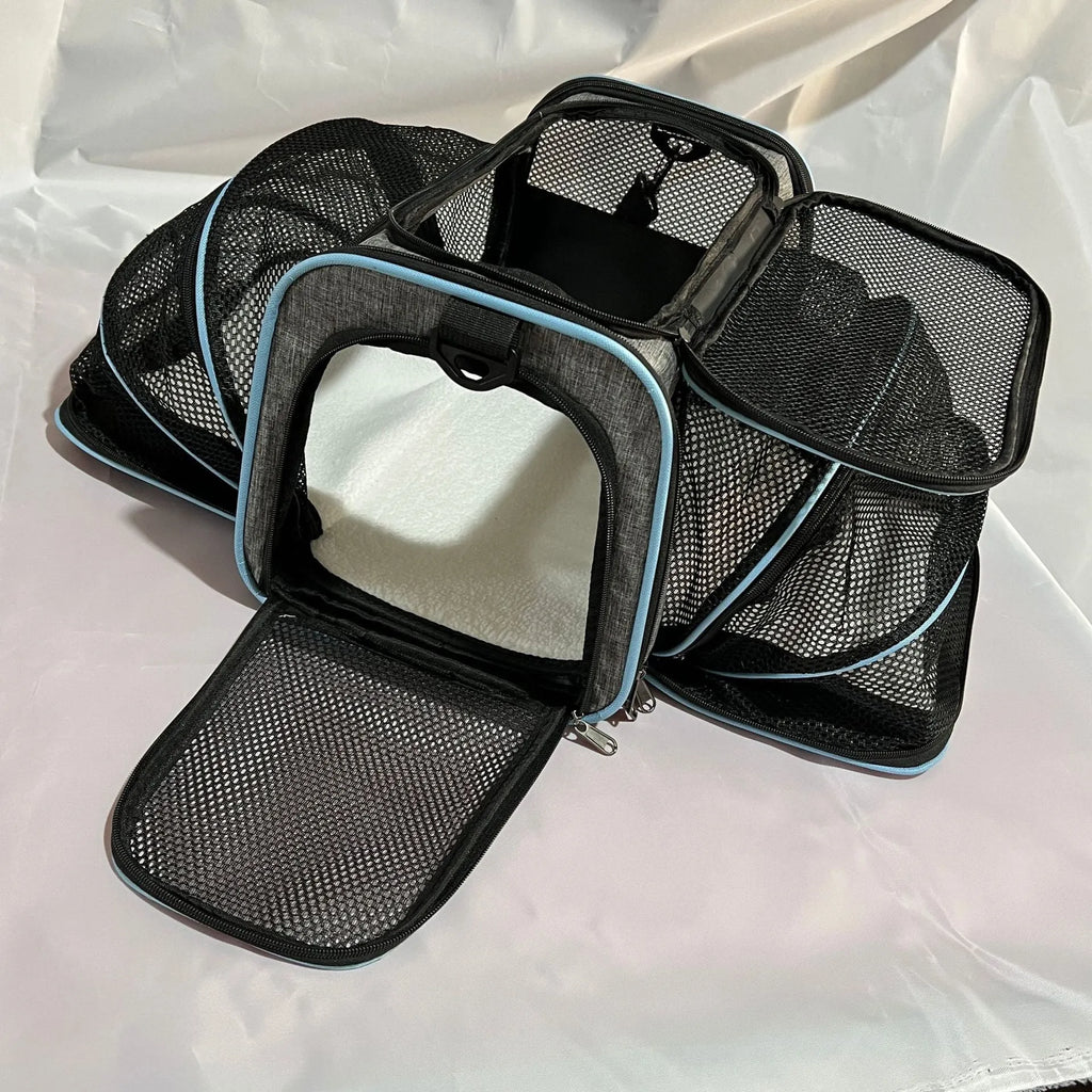 Large capacity cat carrier bag in black with red piping detail showing medium-soft construction