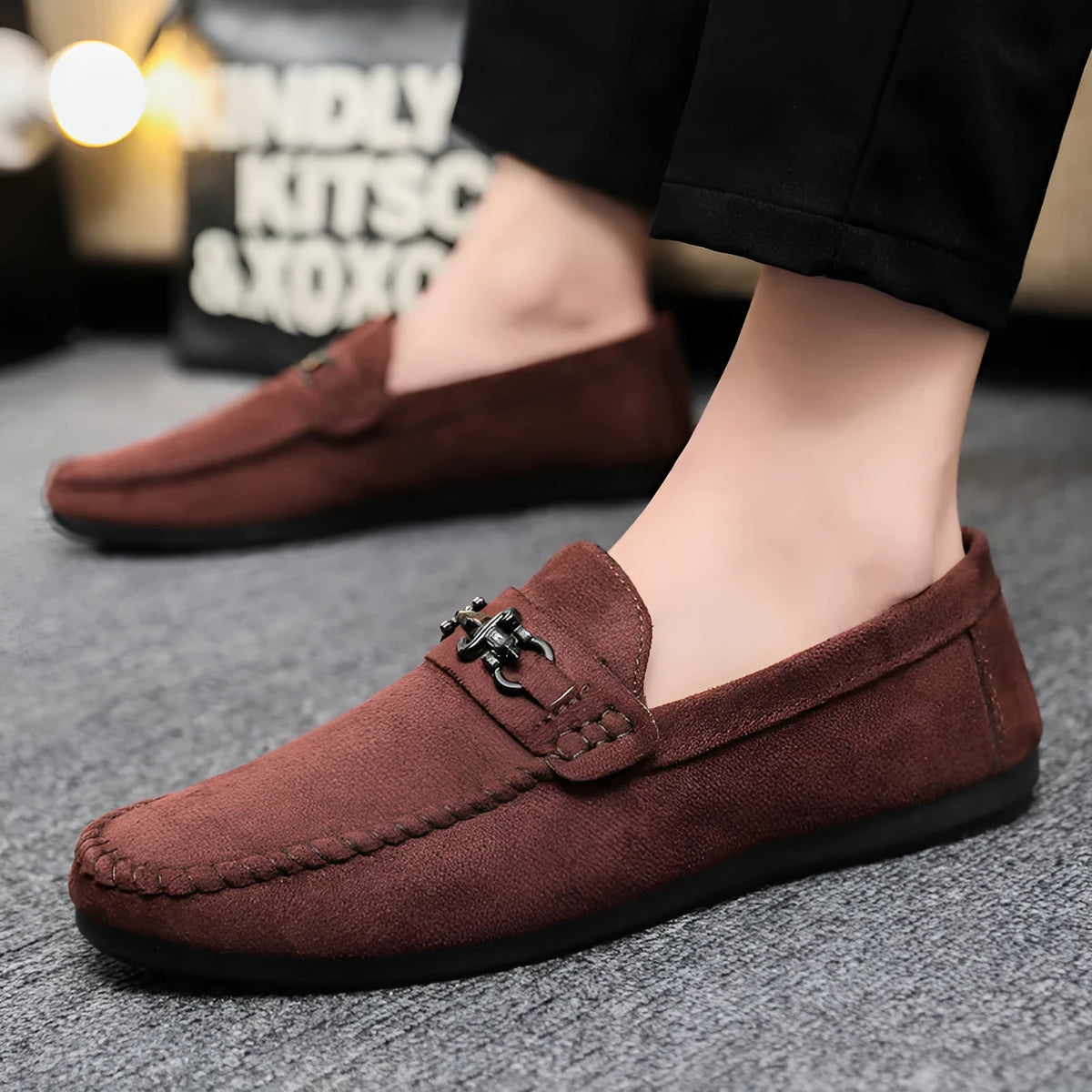 Men's waterproof black and brown slip-on loafers with round toe and low stiletto heel on a rubber sole.