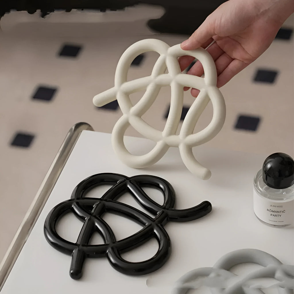 Ceramic heat proof placemat in irregular shape on a dining table