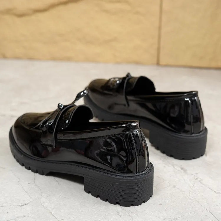 Women's brown loafers with decorative bow detail on artificial PU leather upper