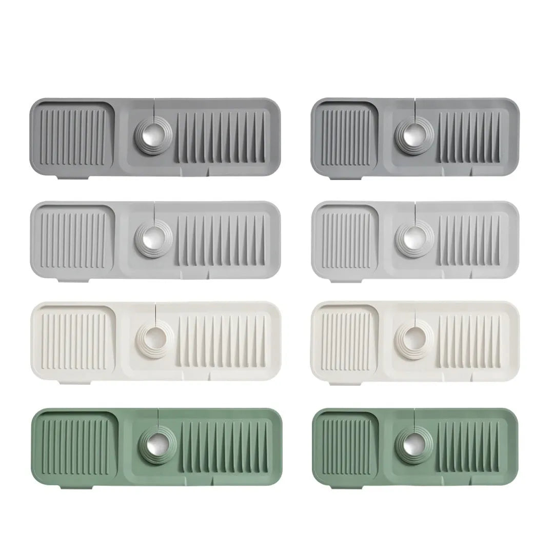 Silicone sink splash guard mat under a kitchen faucet in light grey colour