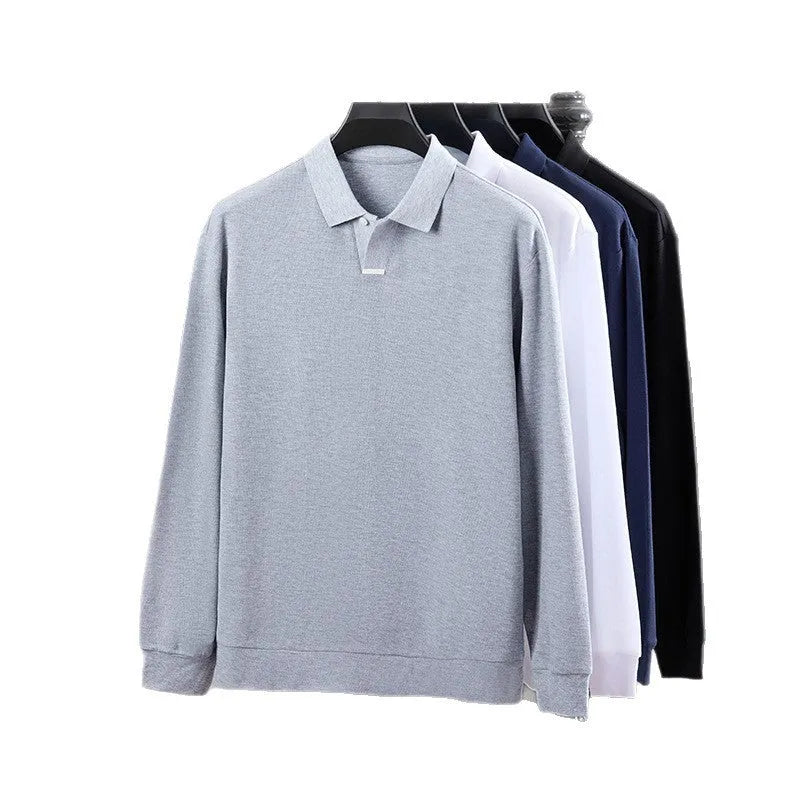 Man wearing a grey long sleeve cotton polo shirt with a lapel collar and loose fit.
