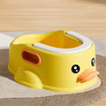 Blue PVC duck-shaped bathtub for washing a small dog, shown on a bathroom floor.