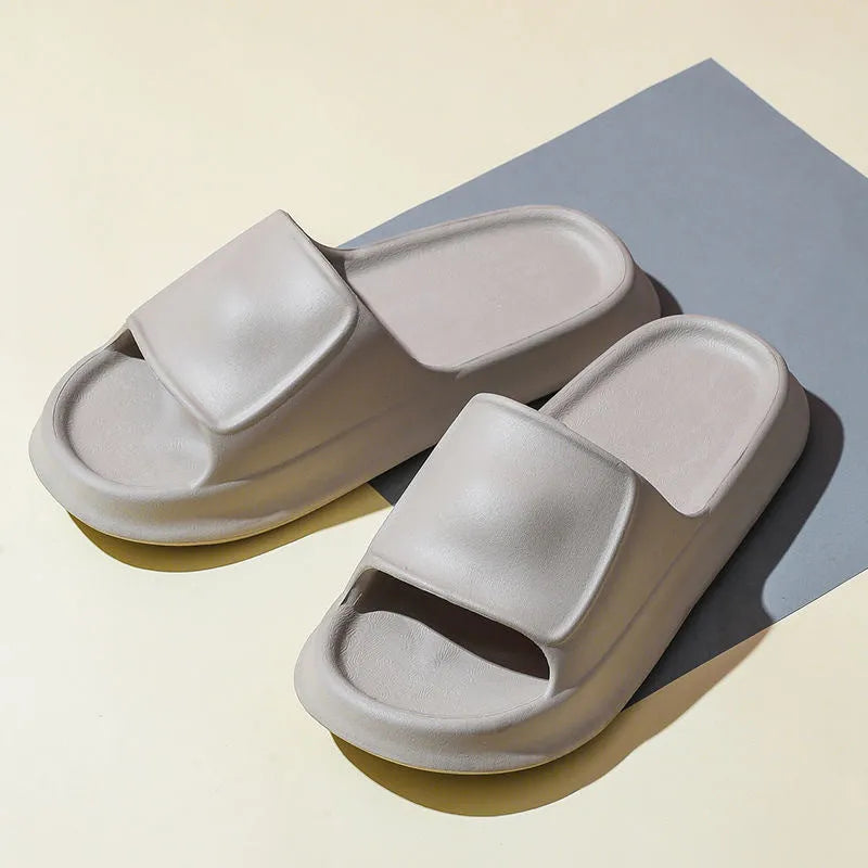 Unisex thick-soled EVA flip-flop slippers in various colours on a white background.
