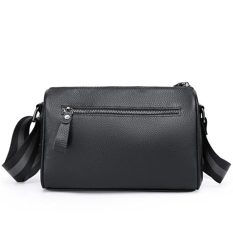 Black genuine leather crossbody bag with one-shoulder design showing 24x16x13cm dimensions