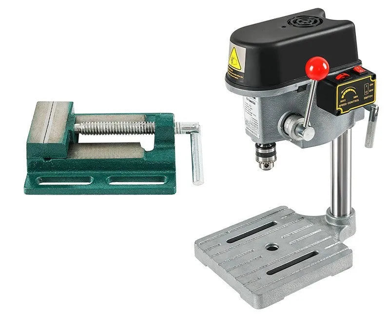 Bench drill and milling machine with cross bench pliers on workshop bench