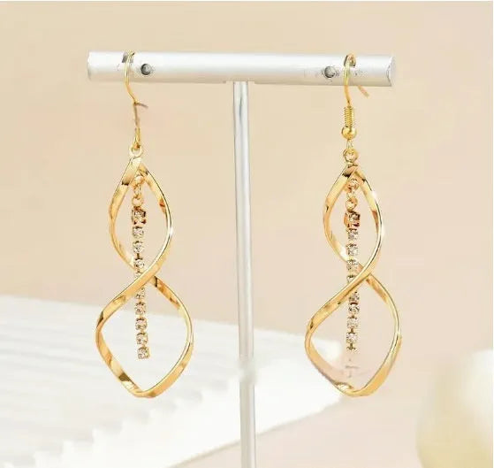 Gold spiral geometric earrings for women with ellipse detailing on alloy metal