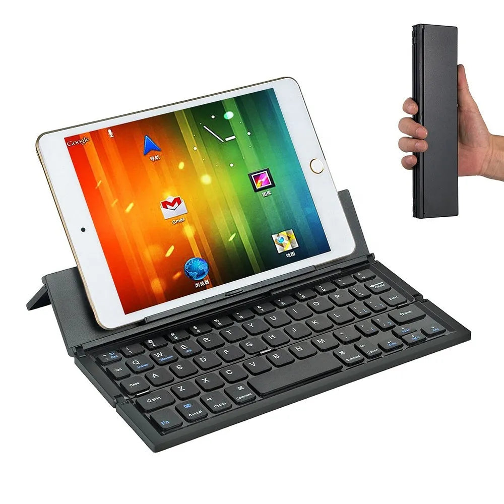 Black mini folding Bluetooth keyboard with bamboo pattern beside 7-inch tablet