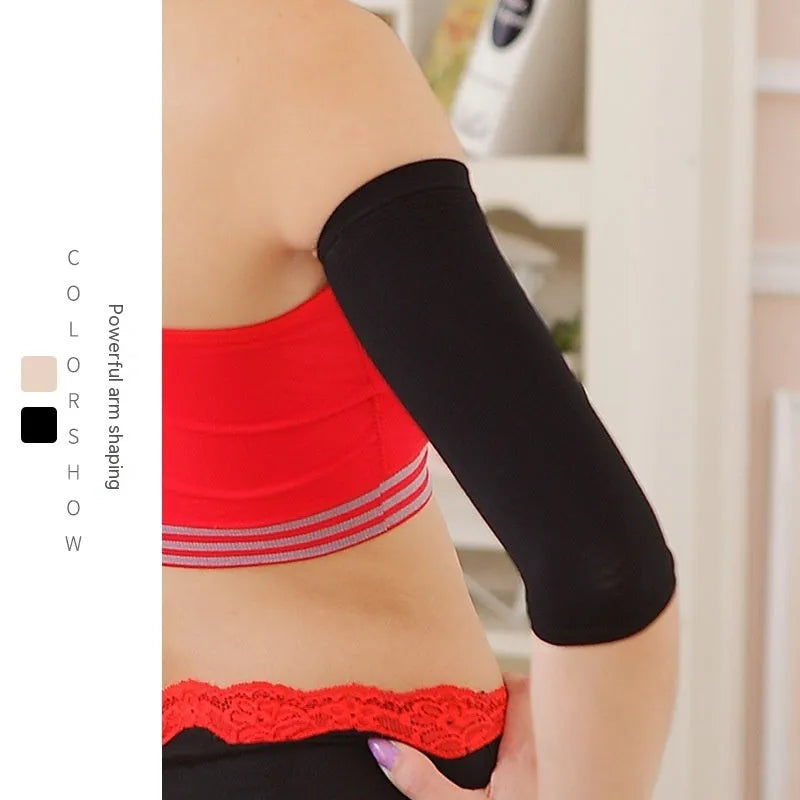 Women's black nylon shaping arm sleeves laid flat showing free size design