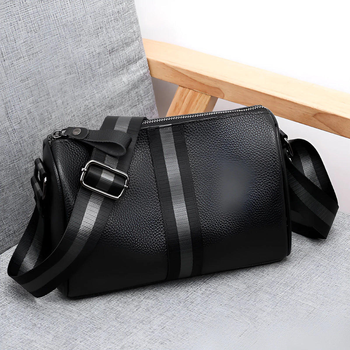 Black genuine leather crossbody bag with one-shoulder design showing 24x16x13cm dimensions