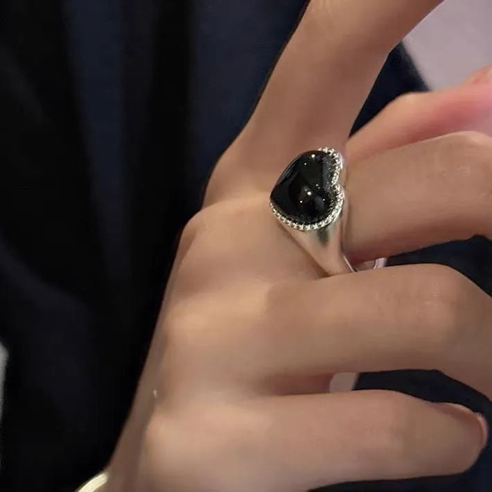 S925 sterling silver adjustable ring with black agate heart in open mouth design.