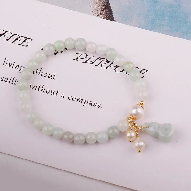 Chinese style jade bracelet with gourd design featuring natural emerald jade ins material.