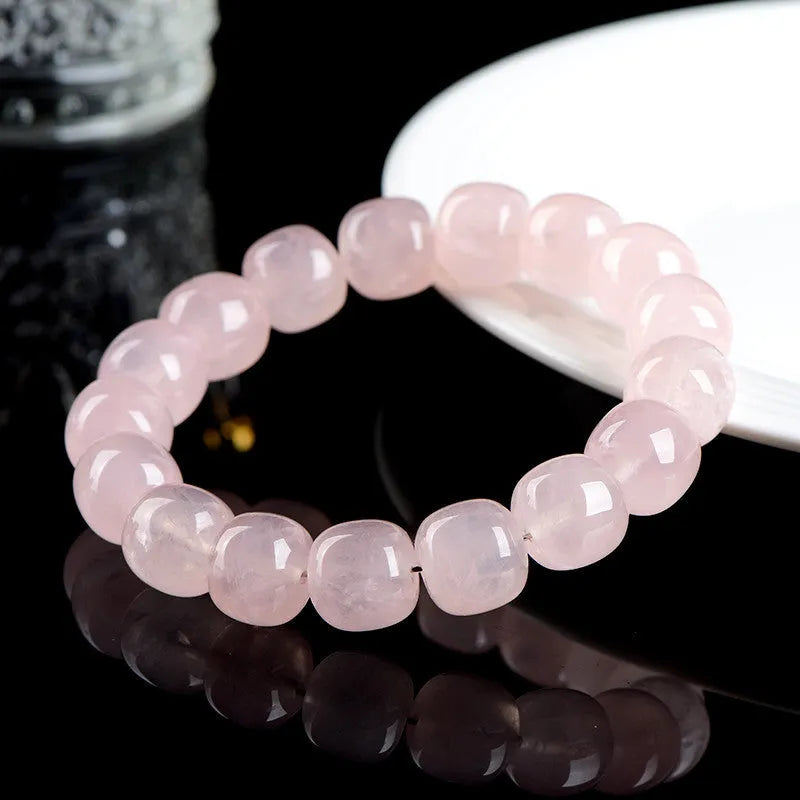 Pink natural crystal bamboo barrel bead bracelet with geometric 11-12mm beads.
