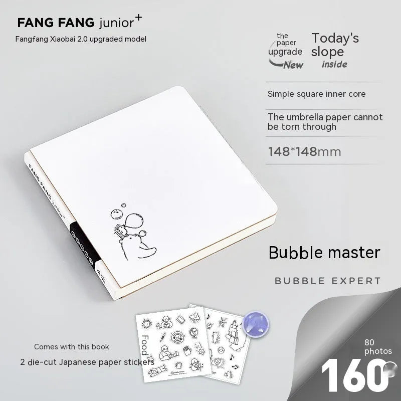 Square white note diary with checkered pages measuring 148mm, includes sticker sheets