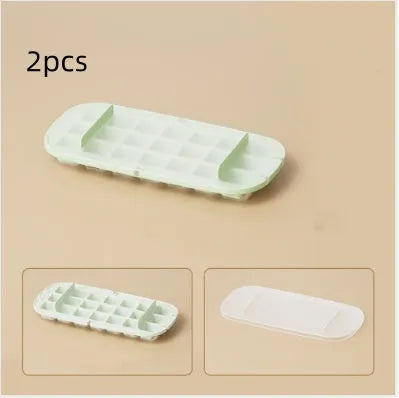 Yellow high-capacity ice cube tray with leverage handle and stored ice shovel.