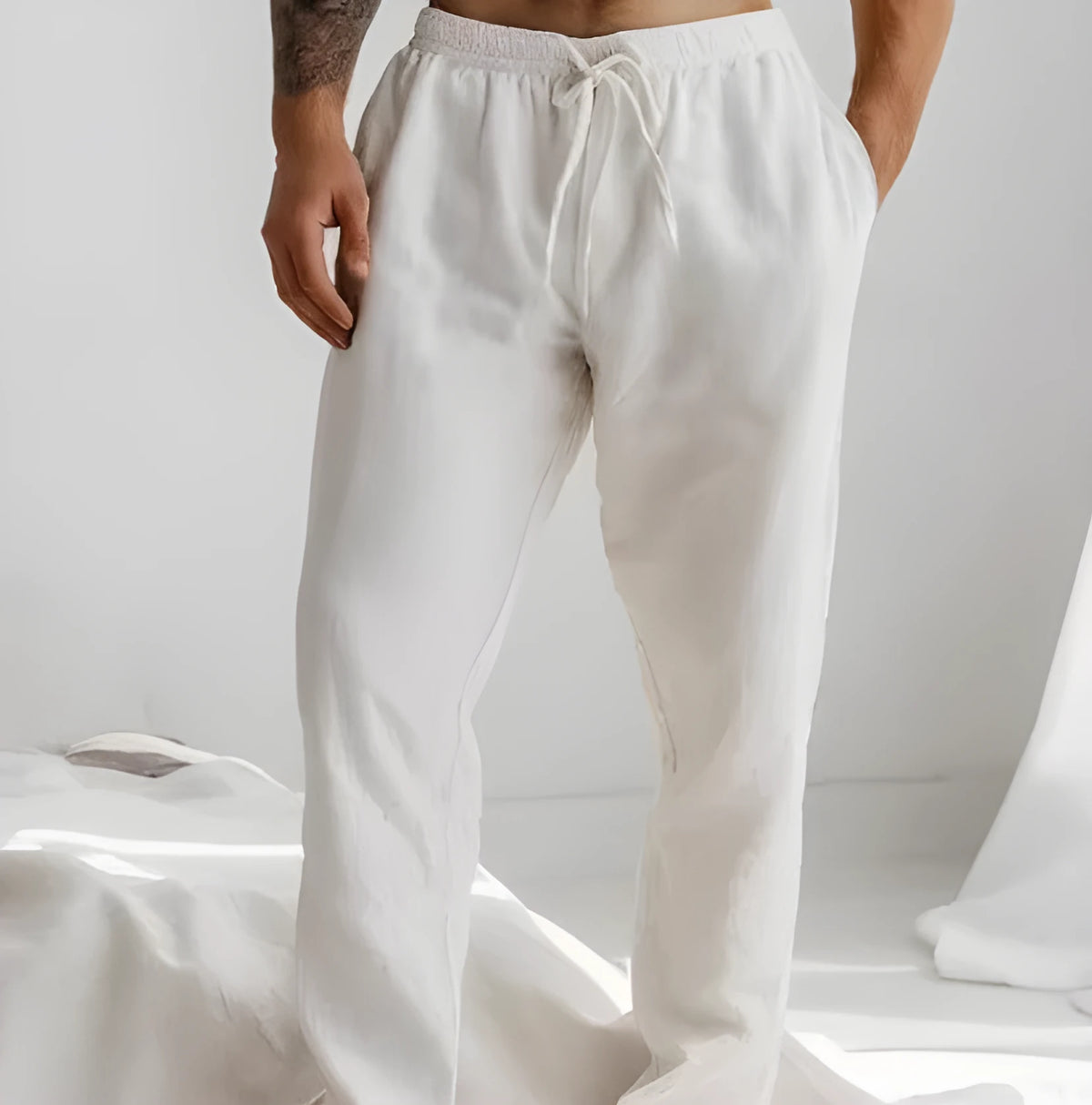 Men's light blue cotton-linen summer trousers with elastic drawstring waist and straight loose leg.