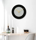 Transparent tempered glass wall clock showing minimalist markings and silent sweep movement