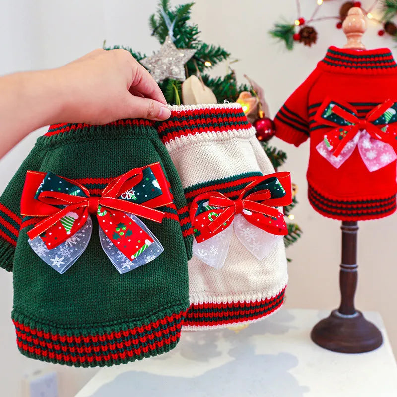 A red polyester Christmas jumper for a dog, showing the festive design and knit fabric.