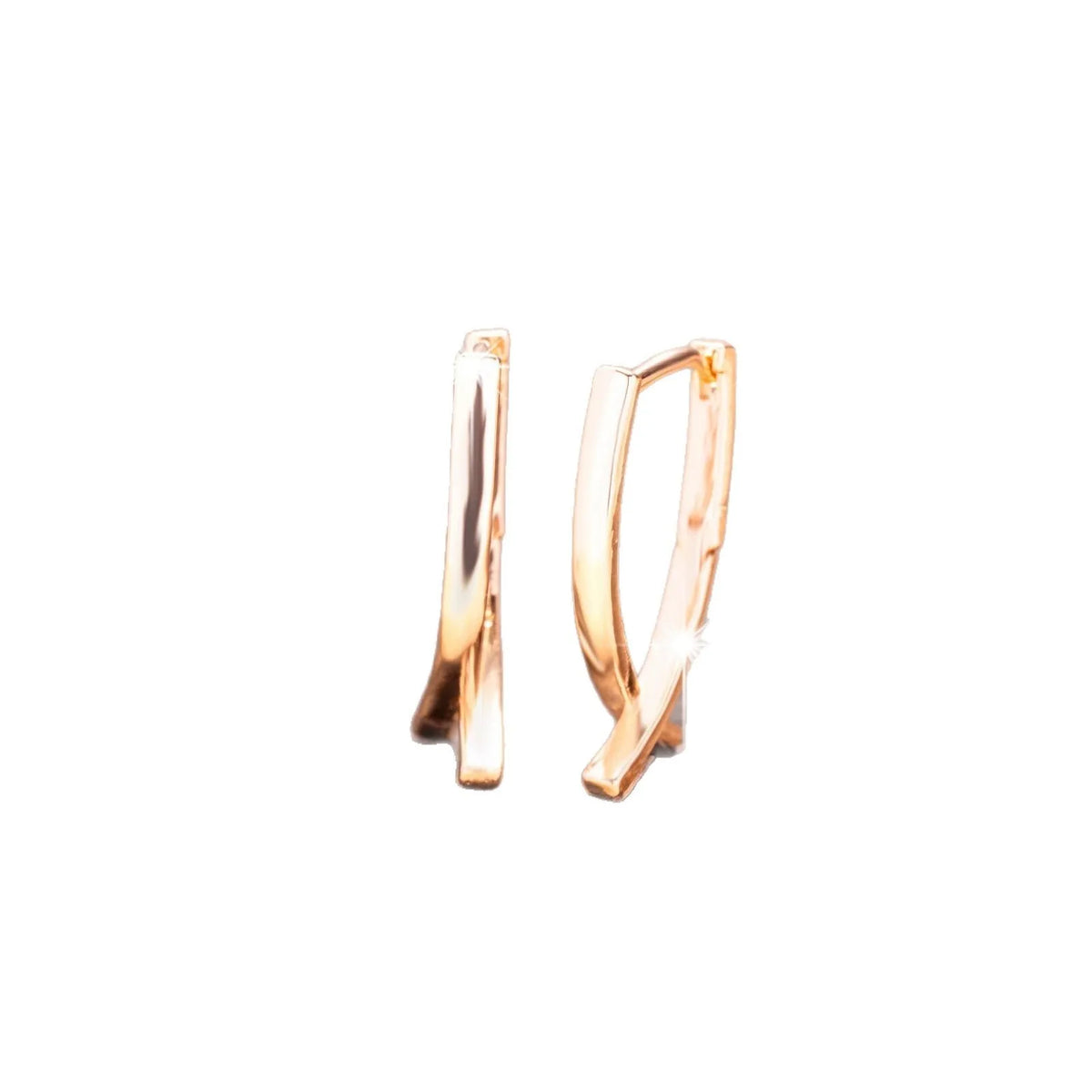 Rose gold cross shaped drop earrings with copper construction and light luxury finish