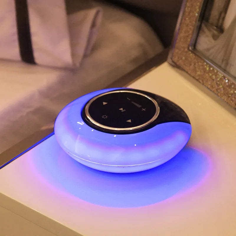 Blue Bluetooth speaker desk lamp with LED light and touch controls on wooden desk