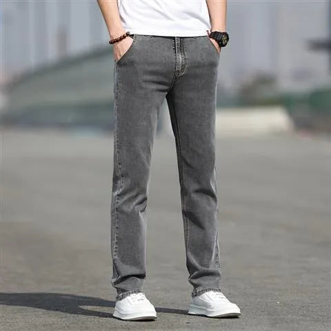 Men's smoky gray straight leg jeans with low waist design and zipper fly closure
