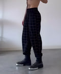 Men's plaid trousers with apron-front design in stretch cotton blend fabric