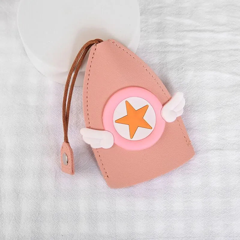 Cartoon-design PU leather pull-out key case for car keys, shown with pull tab extended.