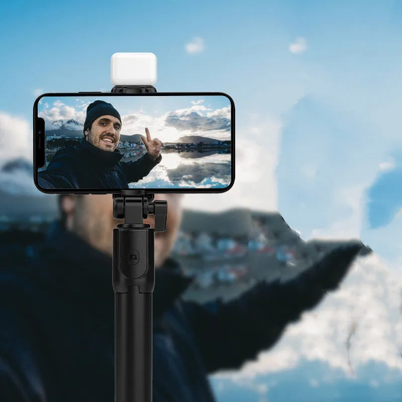 Aluminium Bluetooth selfie stick and tripod phone holder in black, pink, green, or white.