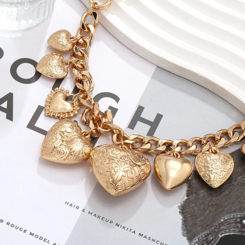 Carved heart pendant necklace on adjustable 41-50cm chain in gold alloy metal