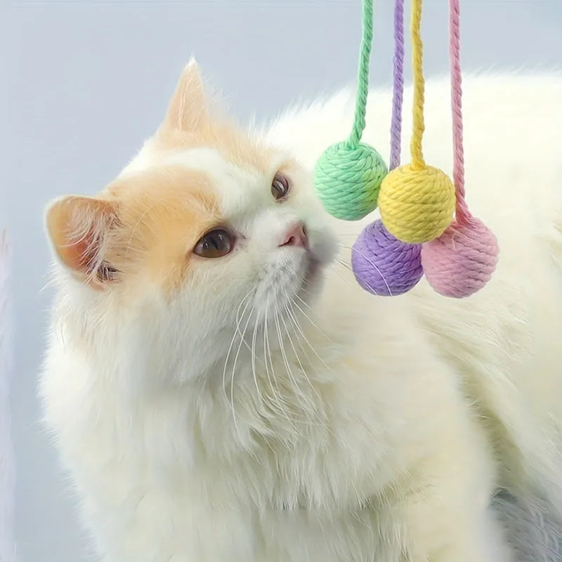 Colourful cat toy ball with rope and internal bell in small and medium sizes.