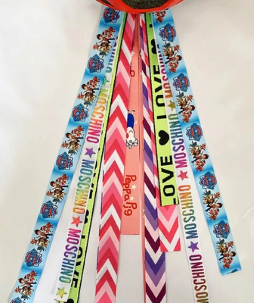 A single colourful ribbon streamer for decorating a child's roller skating or ski helmet.