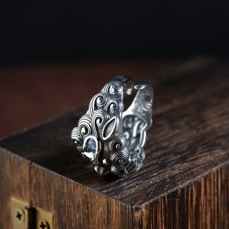 Silver open ring with Jibeast pattern and diamond detailing in retro zodiac design