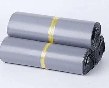 Clear plastic courier bag for clothing with self-adhesive sticker seal, shown in multiple sizes.