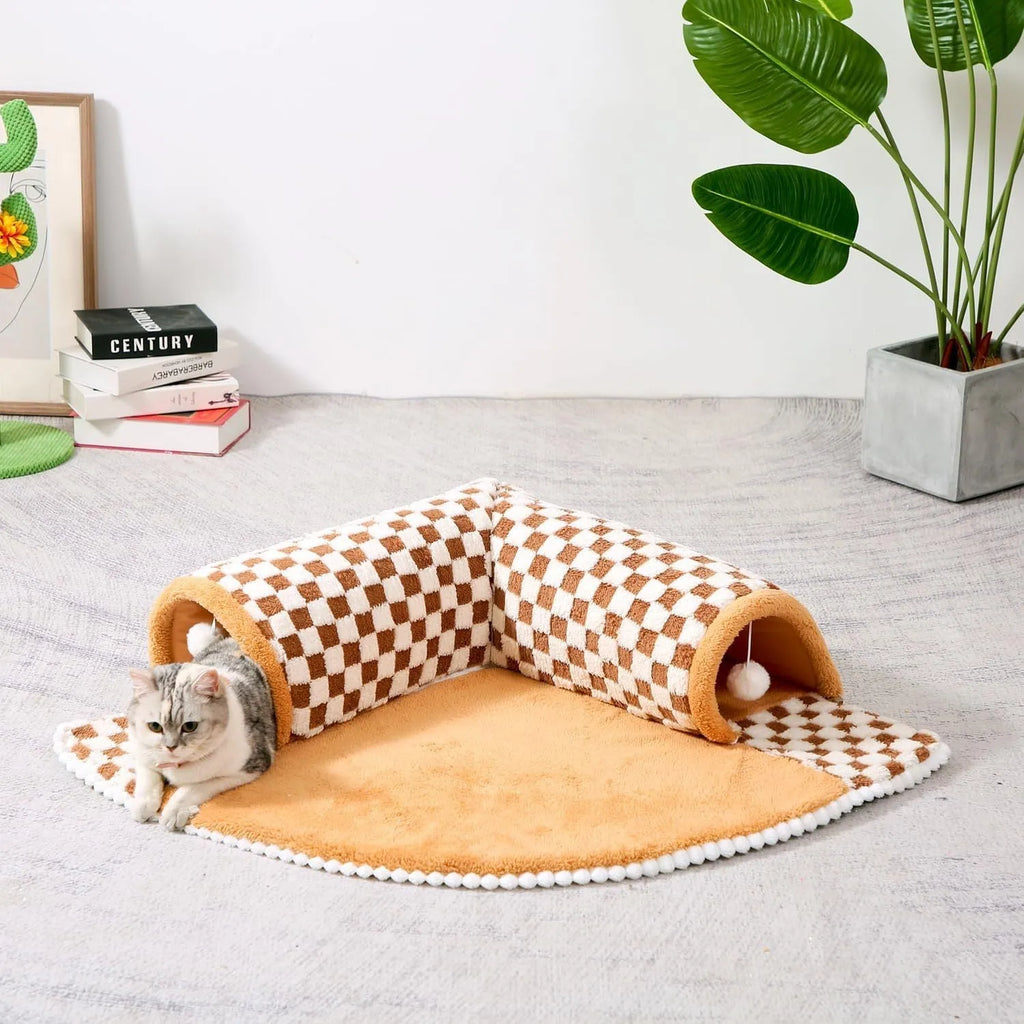 Coffee coloured fan-shaped plush pet bed with a tunnel entrance and anti-slip granular base.