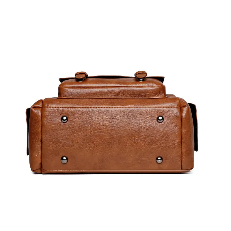 Vintage messenger bag in horizontal square shape with contrast stitching, shown in available colour options