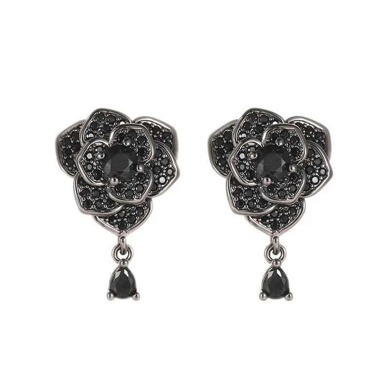 Pair of women's black rose zircon floral stud earrings on electroplated 18K copper.
